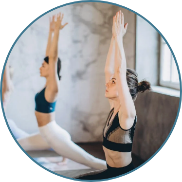 Woman doing yoga for her backpain wishing she had an ergonomic kneeling desk